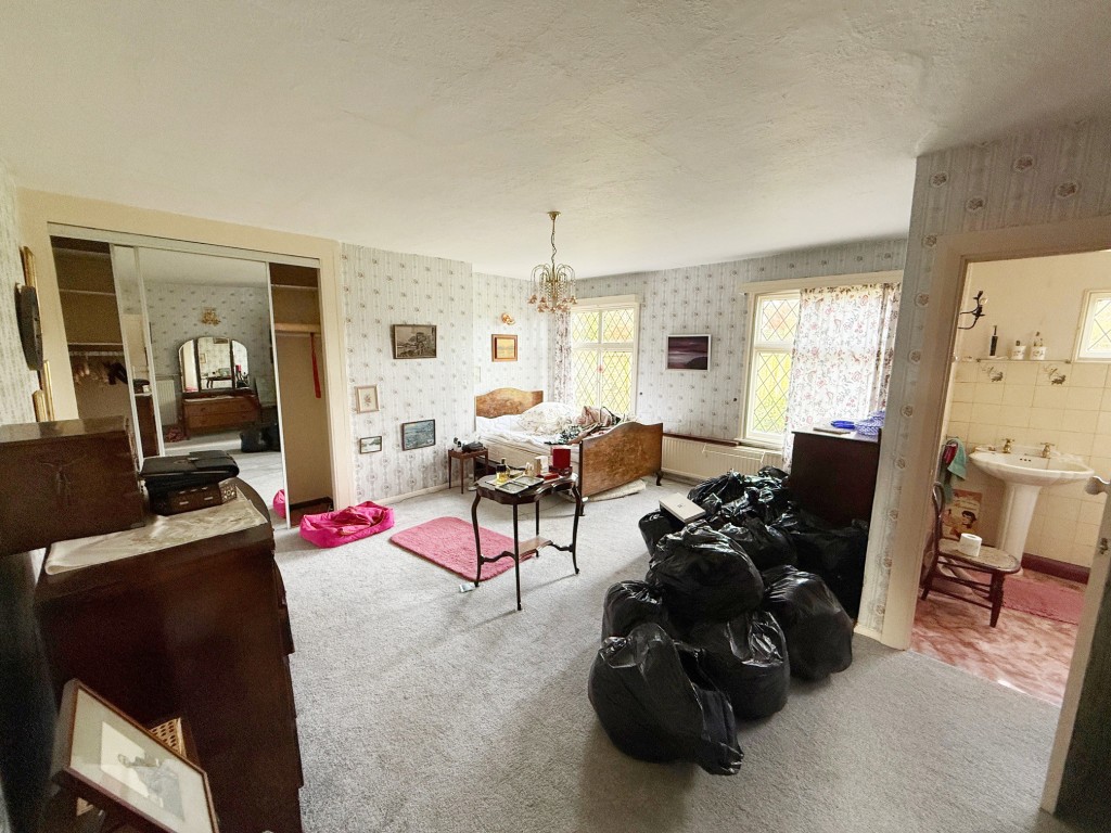 Lot: 155 - DETACHED BUNGALOW FOR IMPROVEMENT IN POPULAR LOCATION - Bedroom one with cupboards and en-suite